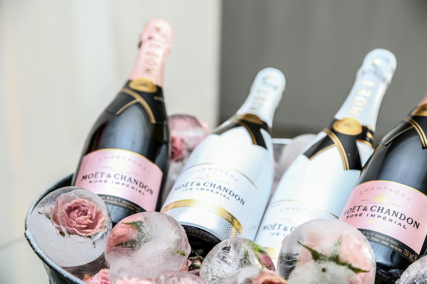 Four bottles of champagne in an ice bucket